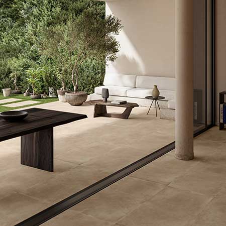 Bowery Beige porcelain tile installed on a modern outdoor patio