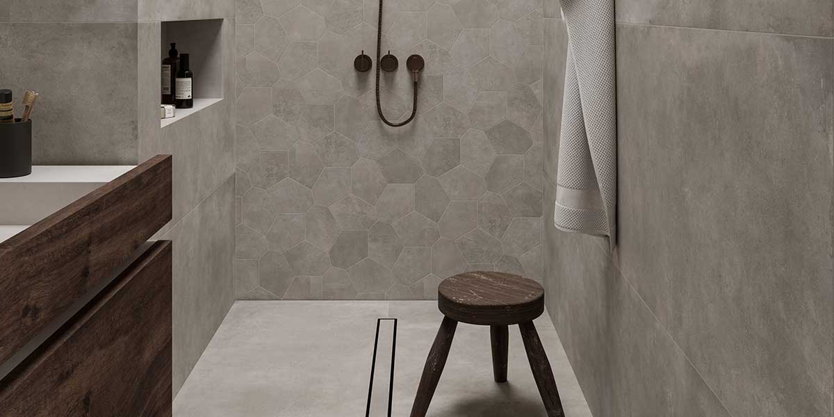 Bowery Grey concrete-look porcelain tile installed in a modern walk-in shower