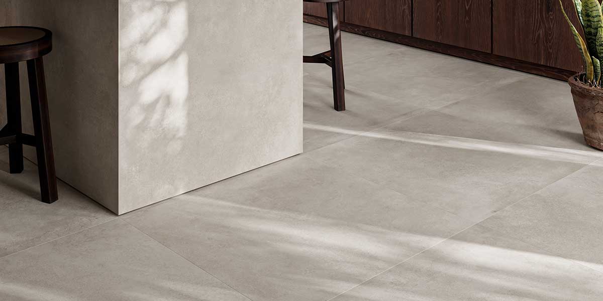 Bowery Silver concrete-look porcelain floor tile in a contemporary kitchen