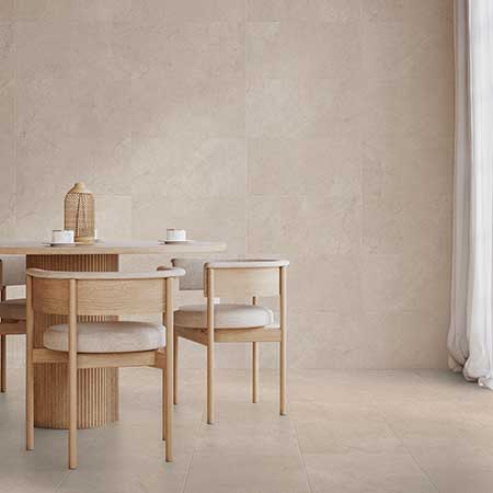Mare Ivory limestone-look porcelain tile installed in a contemporary dining room