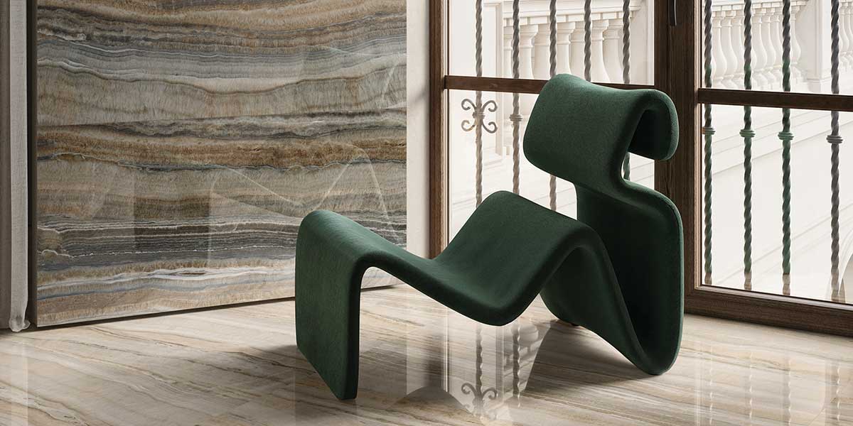 Modern interior featuring Astral Amber onyx-look porcelain tile feature wall with polished floor tile.
