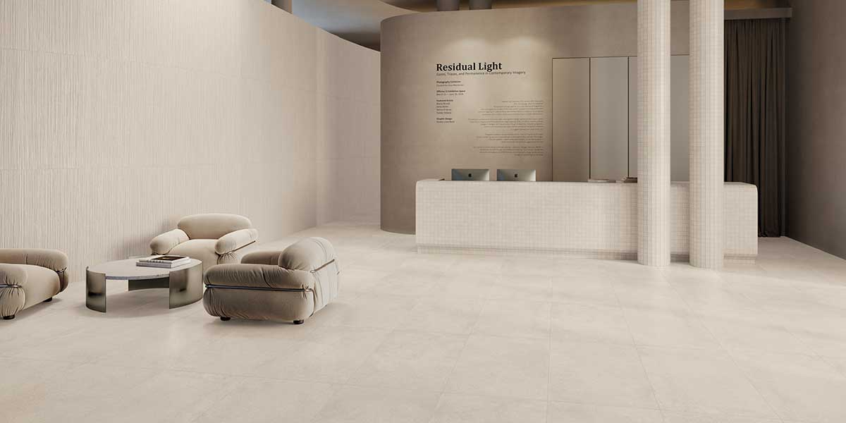 Commercial lobby featuring Pure Concrete White concrete-look porcelain tile and textured wall surfaces.