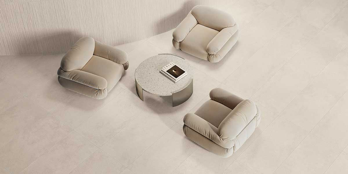 Open-concept living area featuring Pure Concrete White concrete-look porcelain tile flooring.