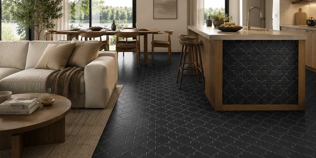 Open-concept kitchen and living room with Star & Cross Black matte porcelain floor tile.
