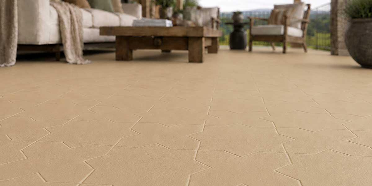 Outdoor living space featuring Star & Cross Sand matte porcelain tile flooring.