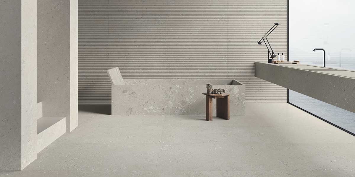 Luxury bathroom featuring Basalto Fine Giant Onde GemmaStone porcelain tile by Ergon