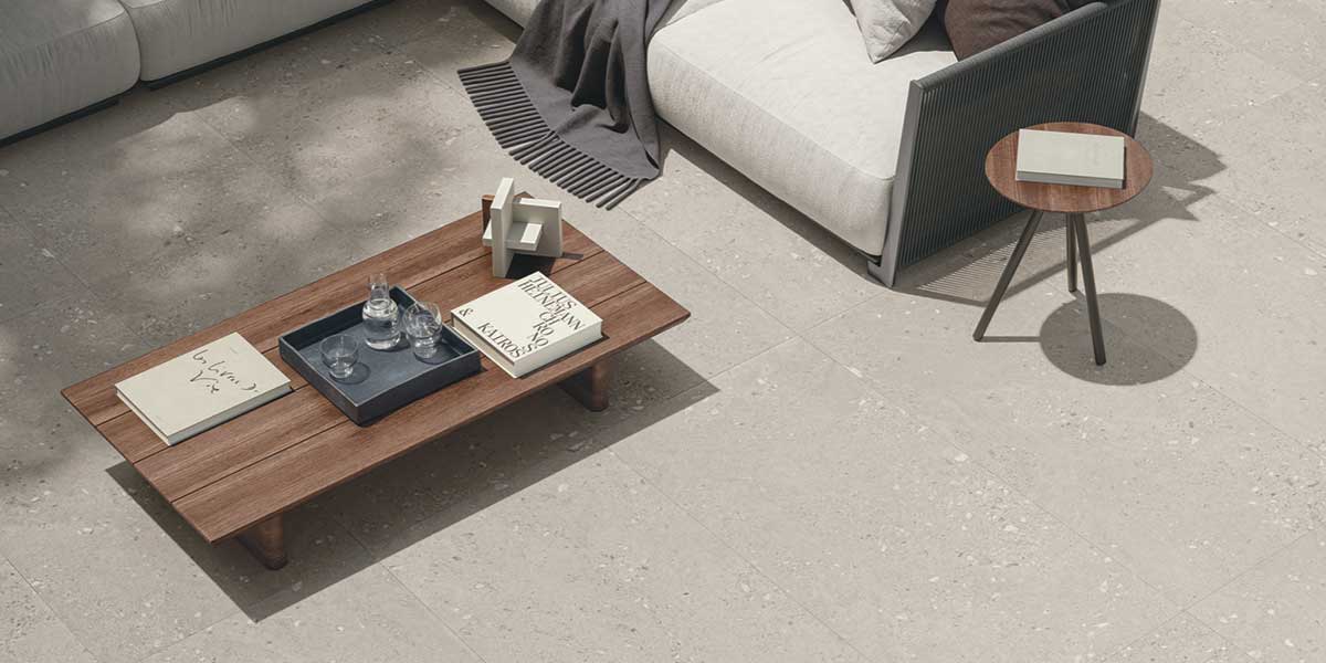 Outdoor patio with Greige Fine GemmaStone porcelain tile by Ergon
