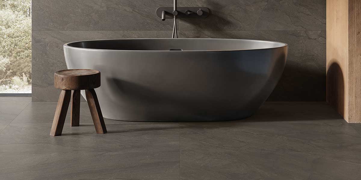Pietra Di Orosei Grigio Bruciato stone-look porcelain tile in a contemporary bathroom