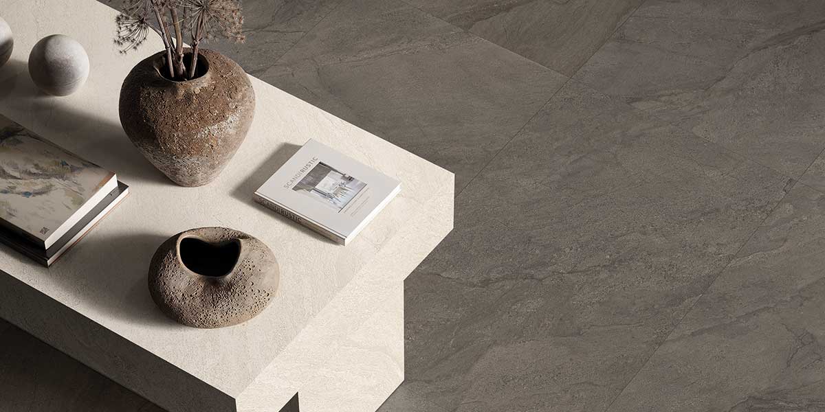 Pietra Di Orosei Grigio Bruciato stone-look porcelain floor tile with flowing veining